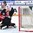 ZUG, SWITZERLAND - APRIL 26: Canada's Zach Sawchenko #30 watches the puck go past him while Switzerland's Robin Fuchs #21 looks on during bronze medal game action at the 2015 IIHF Ice Hockey U18 World Championship. (Photo by Matt Zambonin/HHOF-IIHF Images)


